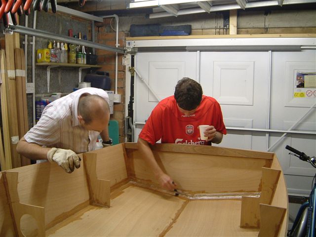 Hull and transom seams glassed in. Assistance from Tramps-4-Hire.