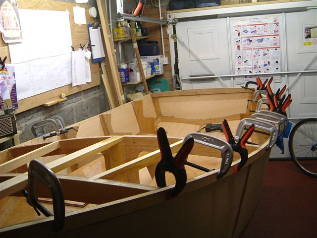 Port gunwale glued and clamped before fitting with ringnails.