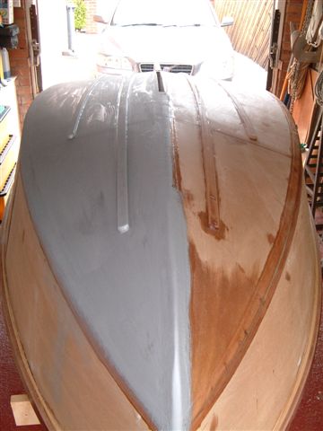 Starboard floor sanded and primed with International Yacht Primer.This should highlight any imperfections.