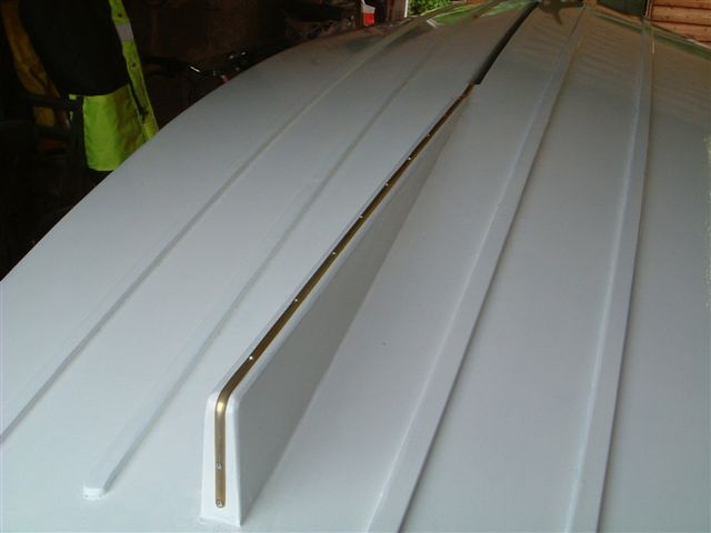 Fitting brass keelband to skeg.