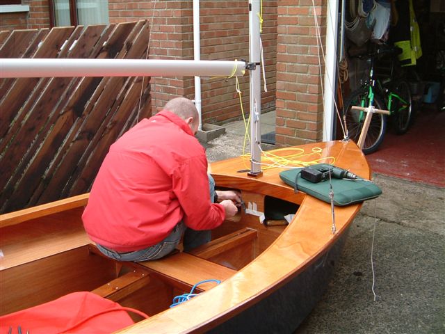 Fitting the cleats for the genoa and spinnaker halyards.